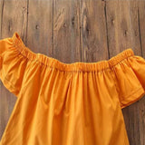 Off shoulder orange top and black bottom set